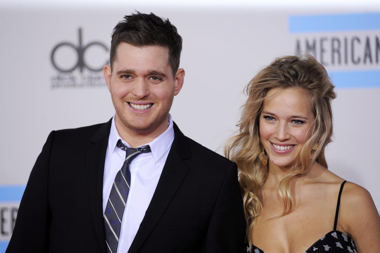 FILE - This Nov. 21, 2010 file photo shows Michael Buble, left, and Luisana Lopilato at the 38th Annual American Music Awards in Los Angeles.  The 37-year-old Canadian singer and his 25-year-old Argentine actress-wife are expecting a baby. They were married in 2011. The couple met in 2009 during a South American concert tour (AP Photo/Chris Pizzello, file)