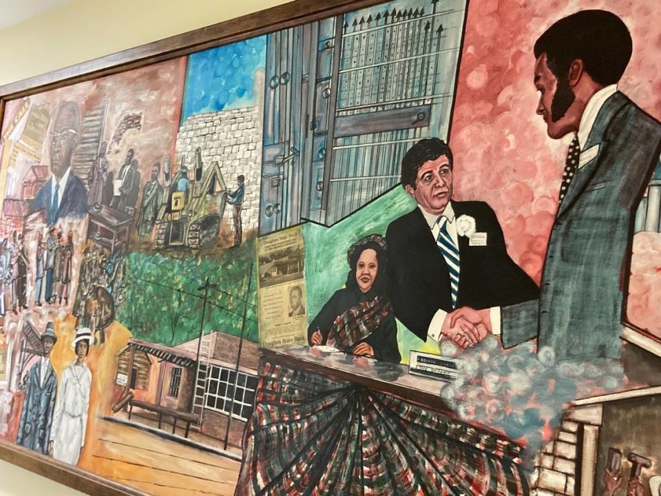 Central section of a mural depicting Douglass State Bank in Kansas City, Kansas. The painting by artist Hank Smith was commissioned in 1974.