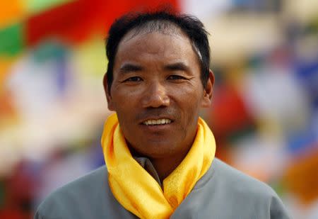 Kami Rita Sherpa, 48, who is attempting a world record by climbing Mount Everest for the 22nd time this season, poses for a picture at Boudhanath Stupa in Kathmandu, Nepal March 26, 2018. REUTERS/Navesh Chitrakar