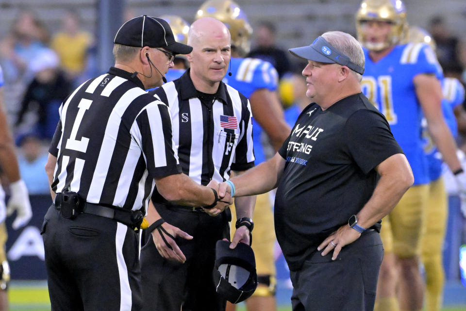 Sep 2, 2023; Pasadena, California, USA; UCLA Bruins head coach Chip Kelly meets with officials prior to the game against the Coastal Carolina Chanticleers at Rose Bowl. Mandatory Credit: Jayne Kamin-Oncea-USA TODAY Sports