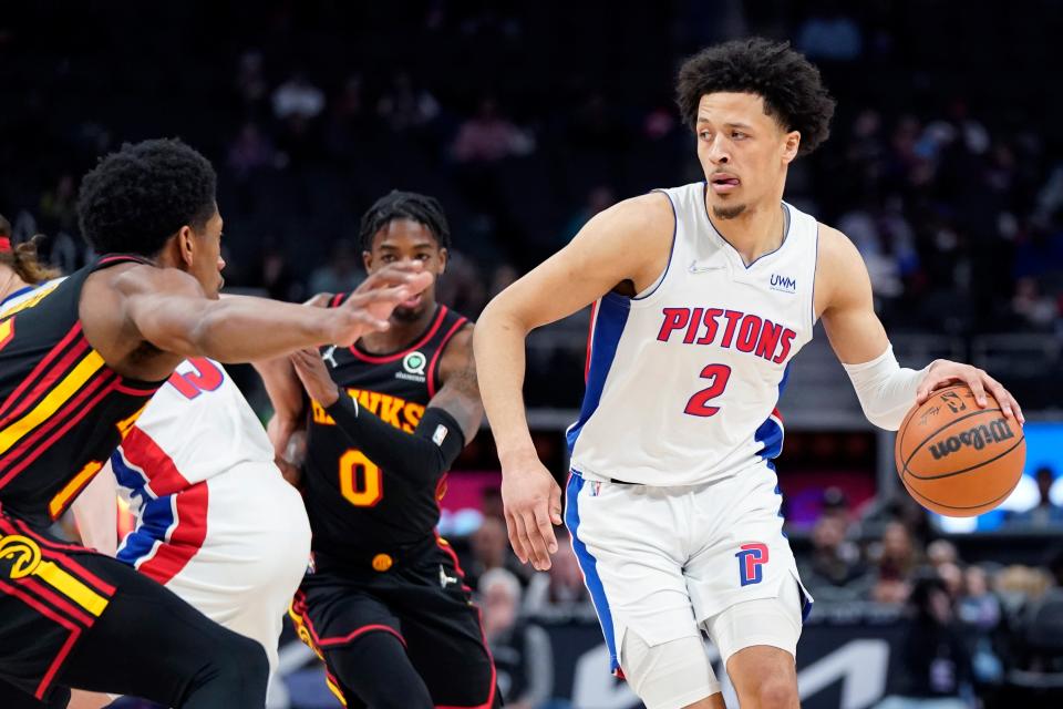 Detroit Pistons guard Cade Cunningham (2) looks to pass during the first half of an NBA basketball game against the Atlanta Hawks, Monday, March 7, 2022, in Detroit.