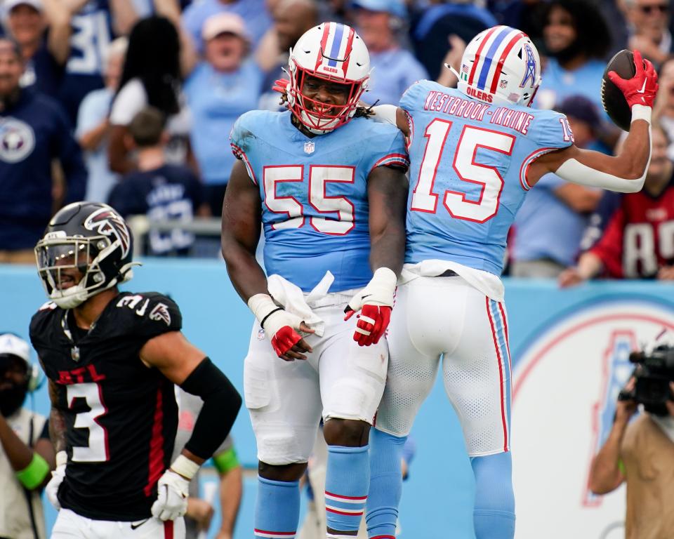 Tennessee Titans wide receiver Nick Westbrook-Ikhine (15) celebrates his touchdown against the Atlanta Falcons with guard Aaron Brewer (55) during the fourth quarter at Nissan Stadium in Nashville, Tenn., Sunday, Oct. 29, 2023.