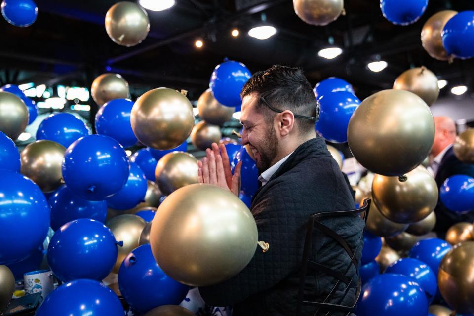 Balloons fall around Austin Martinez at the close of the State of the Port event at the Congressman Solomon P. Ortiz International Center on Wednesday, Nov. 16, 2022, in Corpus Christi, Texas.