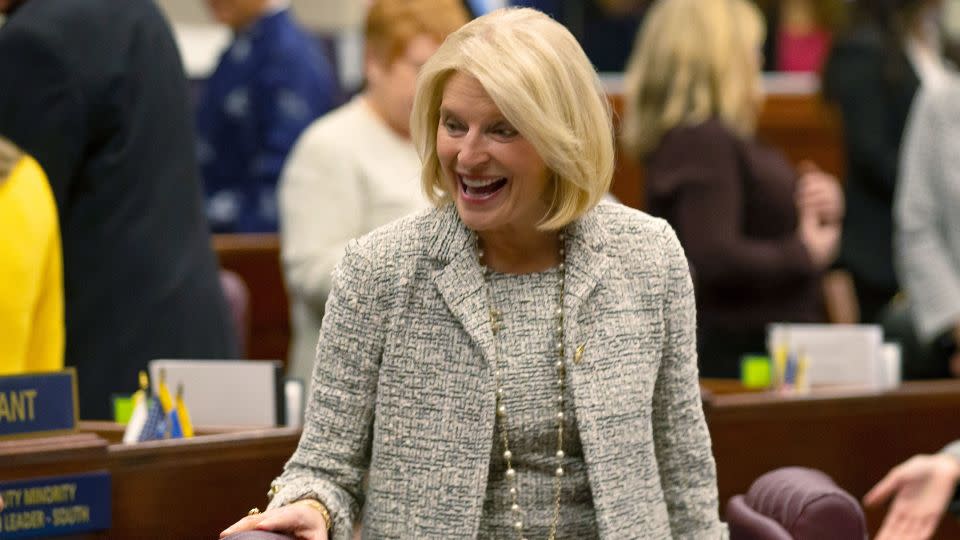 Nevada Republican Assemblywoman Heidi Kasama laughs with lawmakers in Carson City, Nevada, on February 6.  - Tom R. Smedes/AP