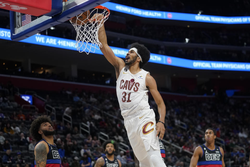 Cleveland Cavaliers center Jarrett Allen (31) dunks against the Detroit Pistons in the first half of an NBA basketball game in Detroit, Friday, Nov. 4, 2022. (AP Photo/Paul Sancya)