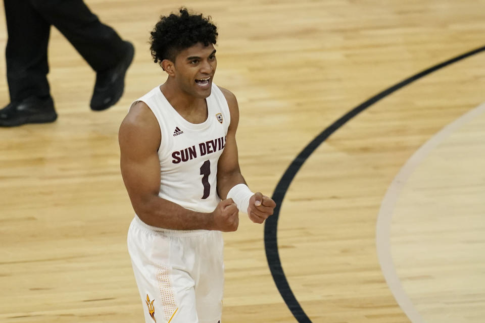 Arizona State's Remy Martin (1) celebrates after a play against Washington State during the second half of an NCAA college basketball game in the first round of the Pac-12 men's tournament Wednesday, March 10, 2021, in Las Vegas. (AP Photo/John Locher)