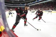 Mar 16, 2019; Raleigh, NC, USA; Carolina Hurricanes center Jordan Staal (11) skates with right wing Andrei Svechnikov (37) against Buffalo Sabres at PNC Arena. The Carolina Hurricanes defeated the Buffalo Sabres 4-2. Mandatory Credit: James Guillory-USA TODAY Sports