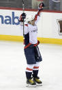 Washington Capitals left wing Alex Ovechkin (8) celebrates his 700th career goal during the third period of an NHL hockey game against the New Jersey Devils Saturday, Feb. 22, 2020, in Newark, N.J. (AP Photo/Bill Kostroun)