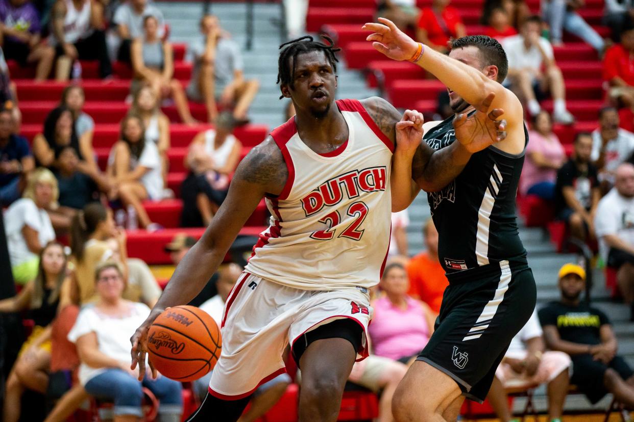 Holland's Coreontae DeBerry drives into the paint against West Ottawa's alumni team  Sunday, Aug. 7, 2022, at Holland High School. 