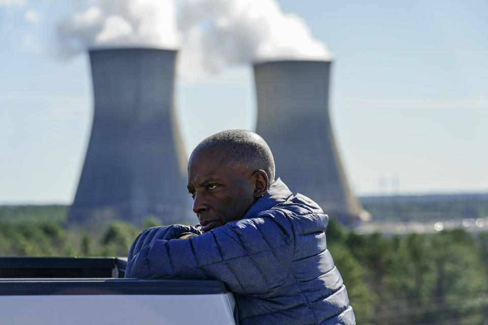 FILE - Georgia Power Co. CEO Chris Womack rests on a company truck as he talks with members of his team at Plant Vogtle nuclear power plant on Jan. 20, 2023, in Waynesboro, Ga. Despite years of delays and billions in overruns, Womack, now CEO of parent Southern Co., says the two new reactors at the site are “absolutely” a success because they will provide reliable power and cheap fuel to the utility’s 2.7 million customers for decades. (AP Photo/John Bazemore, File)