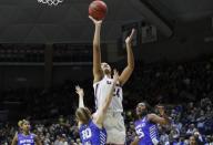 Mar 24, 2019; Storrs, CT, USA; UConn Huskies forward Napheesa Collier (24) makes the basket against Buffalo Bulls guard Autumn Jones (13) during the first half in the second round of the 2019 NCAA Tournament at Gampel Pavilion. Mandatory Credit: David Butler II-USA TODAY Sports