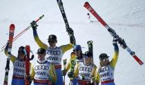 Alpine Skiing - FIS Alpine Skiing World Championships - Alpine Team Event - St. Moritz, Switzerland - 14/2/17 - (L to R) Sweden's Maria Pietilae-Holmner, Mattias Hargin, Andre Myhrer, Gustav Lundbaeck, Emelie Wikstroem and Frida Hansdotter celebrate winning bronze after the final of the parallel slalom Mixed Team event. REUTERS/Denis Balibouse