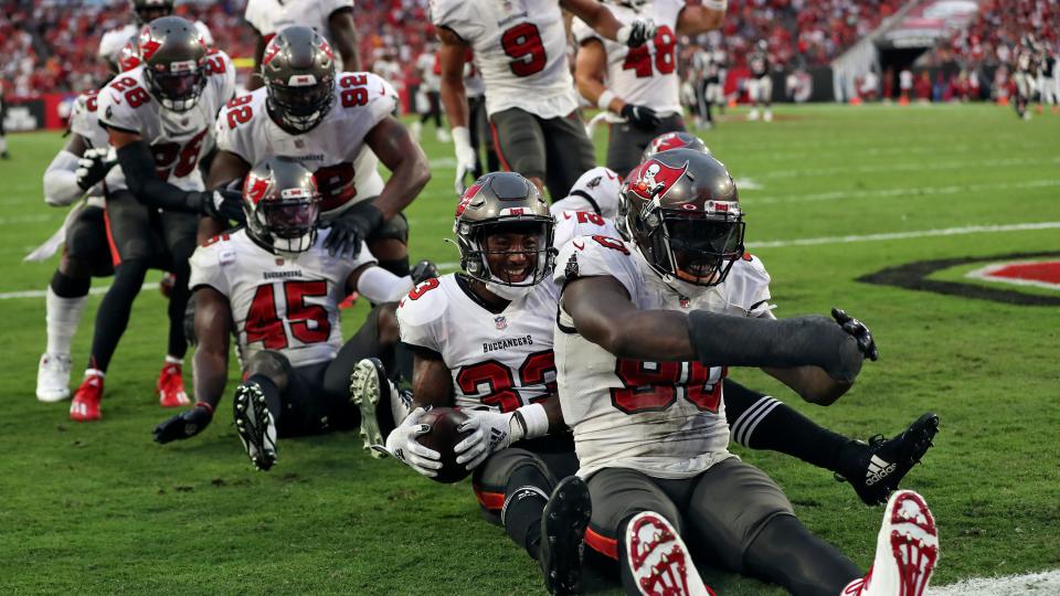 Tampa Bay Buccaneers free safety Jordan Whitehead (33) and the rest of the defense celebrate after a turnover by the Chicago Bears during the second half of an NFL football game Sunday, Oct. 24, 2021, in Tampa, Fla.