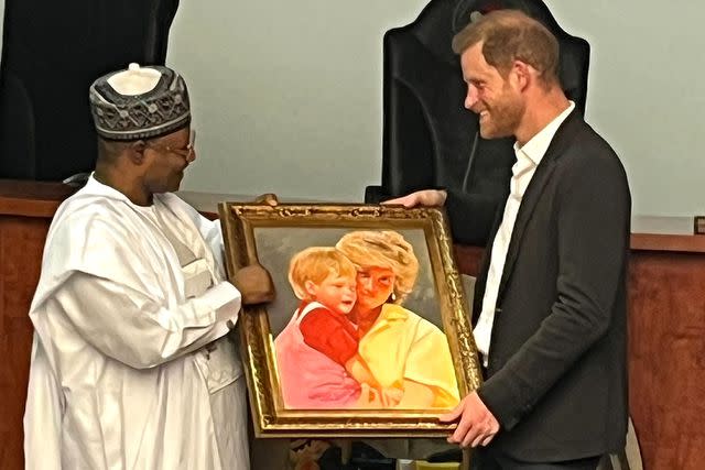 <p>Simon Perry</p> Prince Harry accepts a painting of a photo of him with his late mother Princess Diana during his trip to Nigeria on May 10, 2024.
