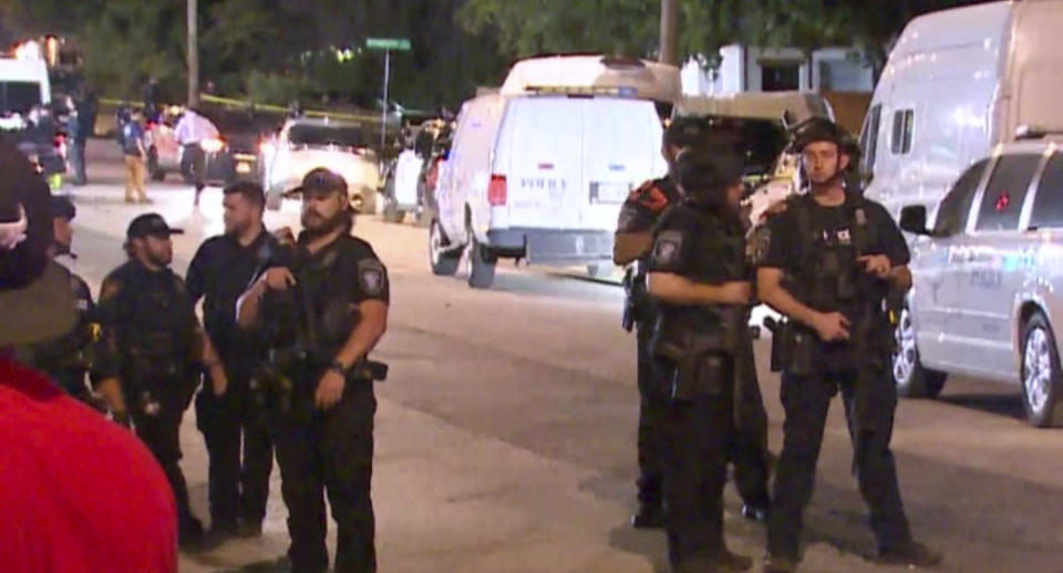 Police arrive on the scene of a deadly shooting late Monday, July 3, 2023 in Forth Worth, Texas. Authorities say gunfire erupted following a local festival in the Como neighborhood in the city's southwest. (WFAA via AP)