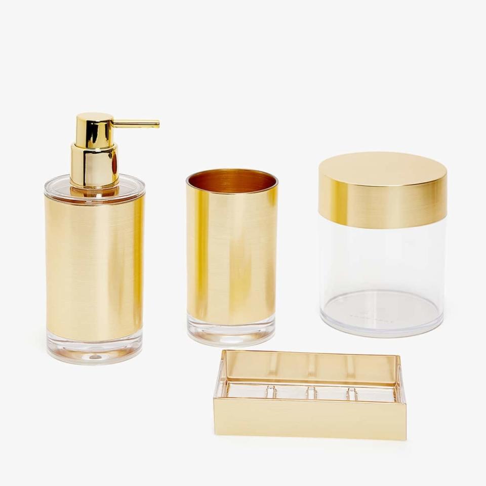 <p>Want an easy way to glam up your morning routine? Decant your hand soap into a refillable dispenser and stash your accessories in matching containers for a Top Shelfie-worthy bathroom.</p> <p><strong>Shop It Here:</strong> Shiny gold bathroom set, $9.90-$17.90, <a rel="nofollow noopener" href="https://www.zarahome.com/us/bathroom/bathroom-accessories/shiny-gold-bathroom-set-c1020117113p300524534.html?colorId=300524534&parentId=300524534" target="_blank" data-ylk="slk:zarahome.com;elm:context_link;itc:0;sec:content-canvas" class="link ">zarahome.com</a></p>