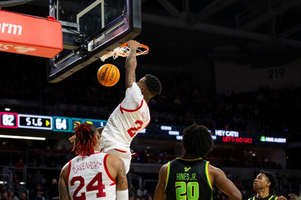 Cincinnati Bearcats guard Landers Nolley II (2) dunks during the second half of an NCAA men’s college basketball game on Saturday, Feb. 11, 2023 at Fifth Third Arena in Cincinnati. The Bearcats defeated the South Florida Bulls 84-65. 