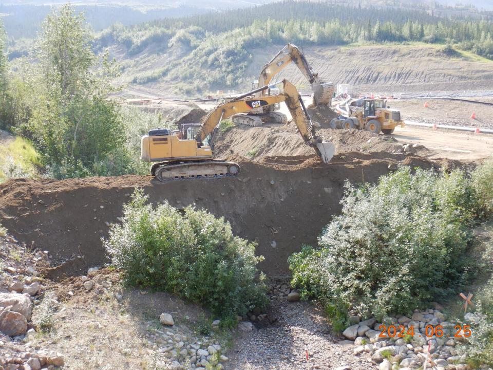 Building containment dams at the Eagle mine site in central Yukon after a heap leach pad failure, June 2024.