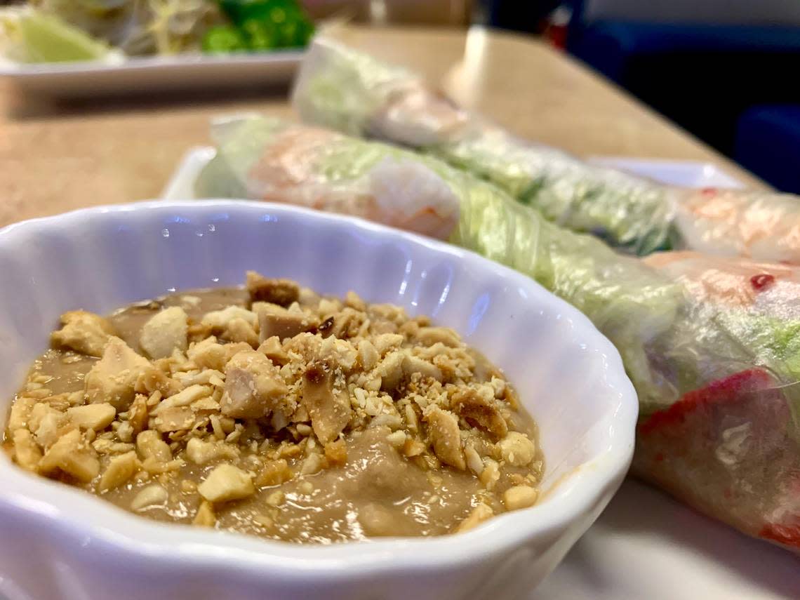 Freshly chopped peanuts add texture to the sauce accompanying these shrimp spring rolls at VK Viet Kitchen in Tacoma’s Lincoln District.