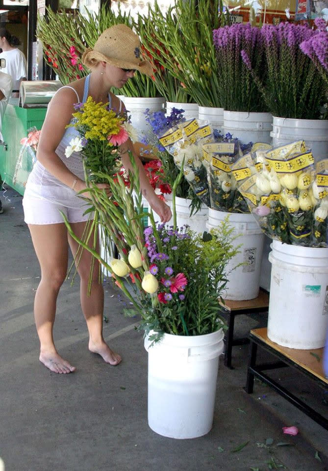 The year 2004 was an especially footloose one for Brit-Brit. She also hit a farmers’ market in Santa Monica, Calif., without any footwear. Nothing was coming between her and that bouquet. (Photo: Rex)