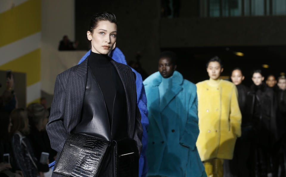 Model Bella Hadid wears a creation as part of the Max Mara women's Fall-Winter 2019-20 collection, unveiled during the Fashion Week in Milan, Italy, Thursday, Feb. 21, 2019. (AP Photo/Antonio Calanni)