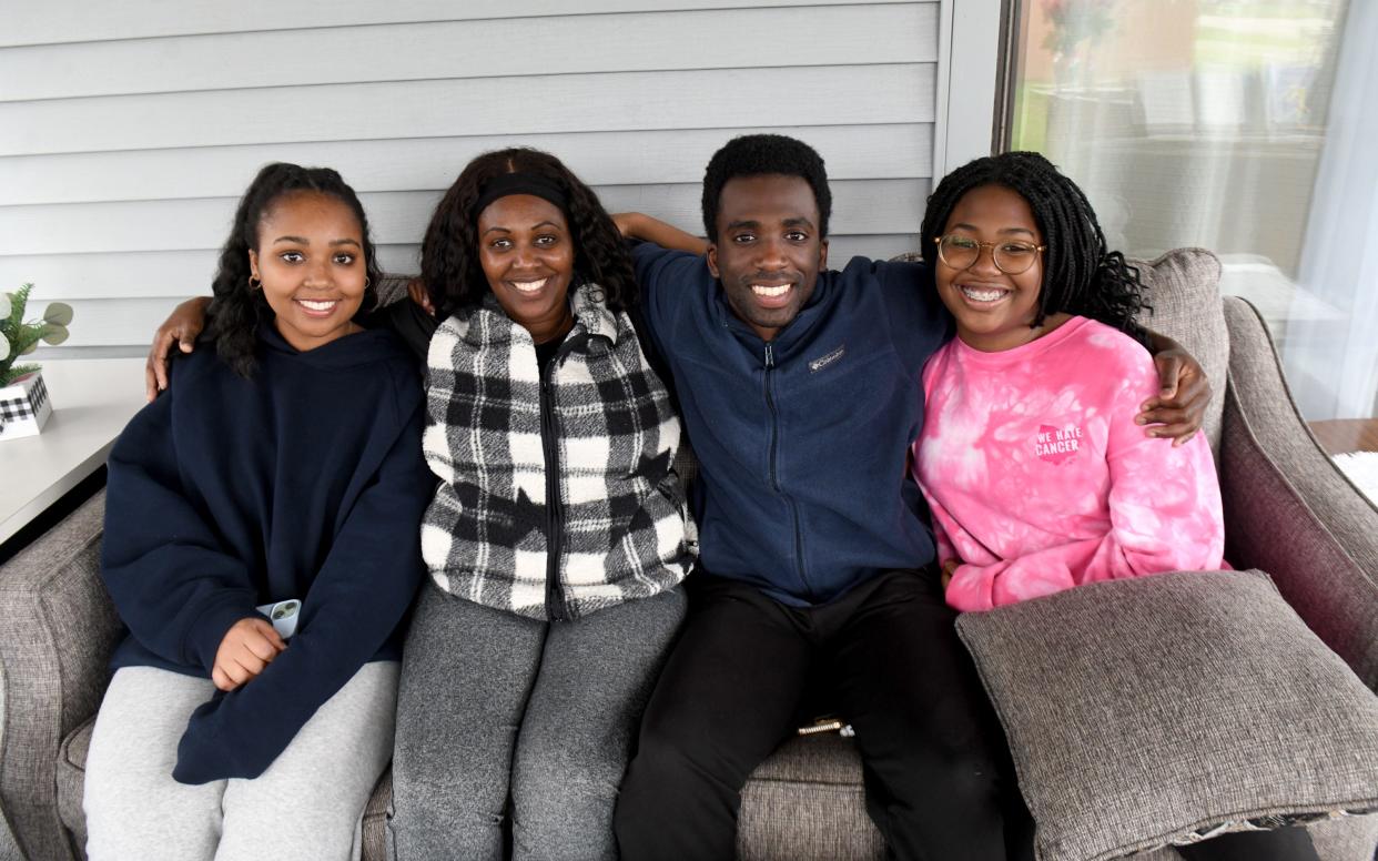 From left, Tiffany, Chantal, Nestor and Destiny Nshimiye. The family's deep Catholic faith, and their belief in Eric Nshimiye, have comforted them in the weeks since his arrest.