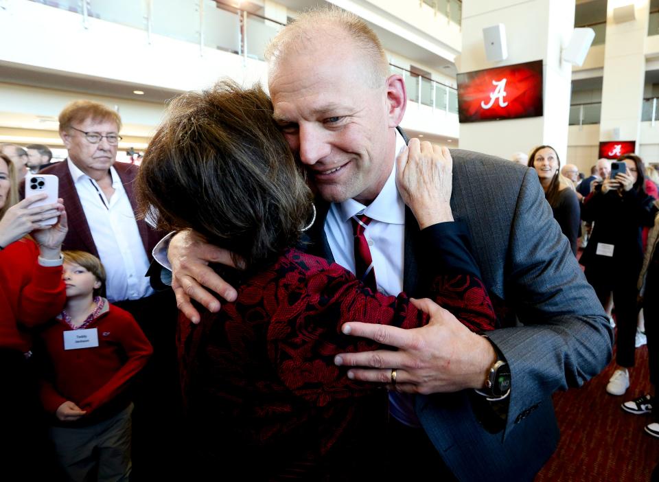 The University of Alabama introduced new head football coach Kalen DeBoer with a news conference at Bryant-Denny Stadium on Jan. 13, 2024. Terry Saban greets DeBoer with a hug after his introduction.