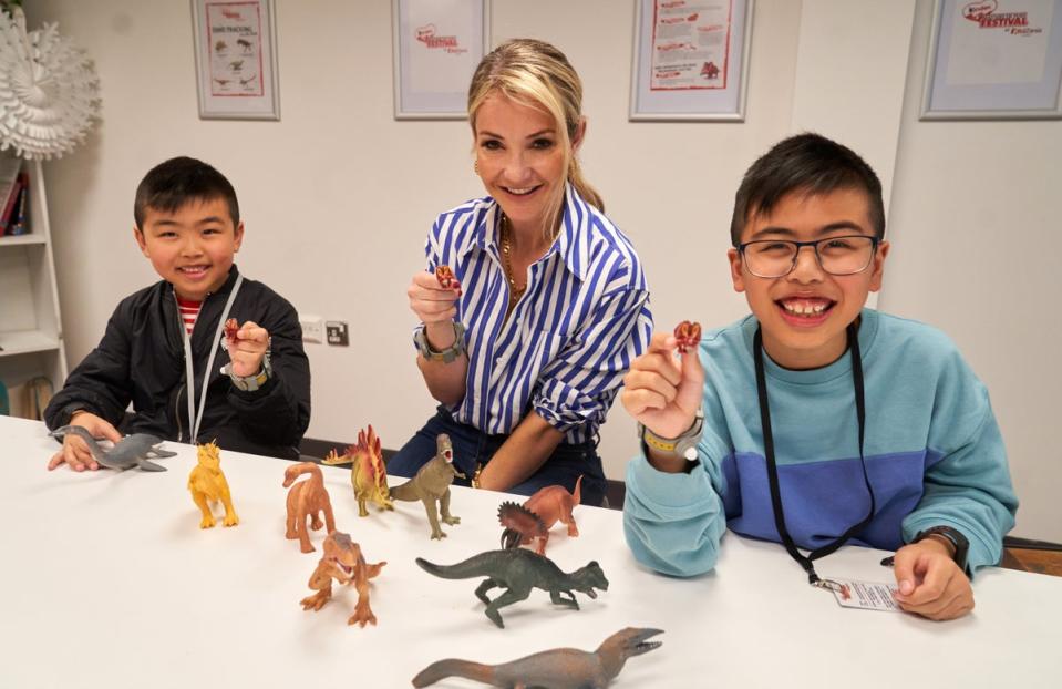 Helen Skelton getting in on some dinosaur acton at Kinder Masters of Play Festival (Simon Jacobs/PA Wire)