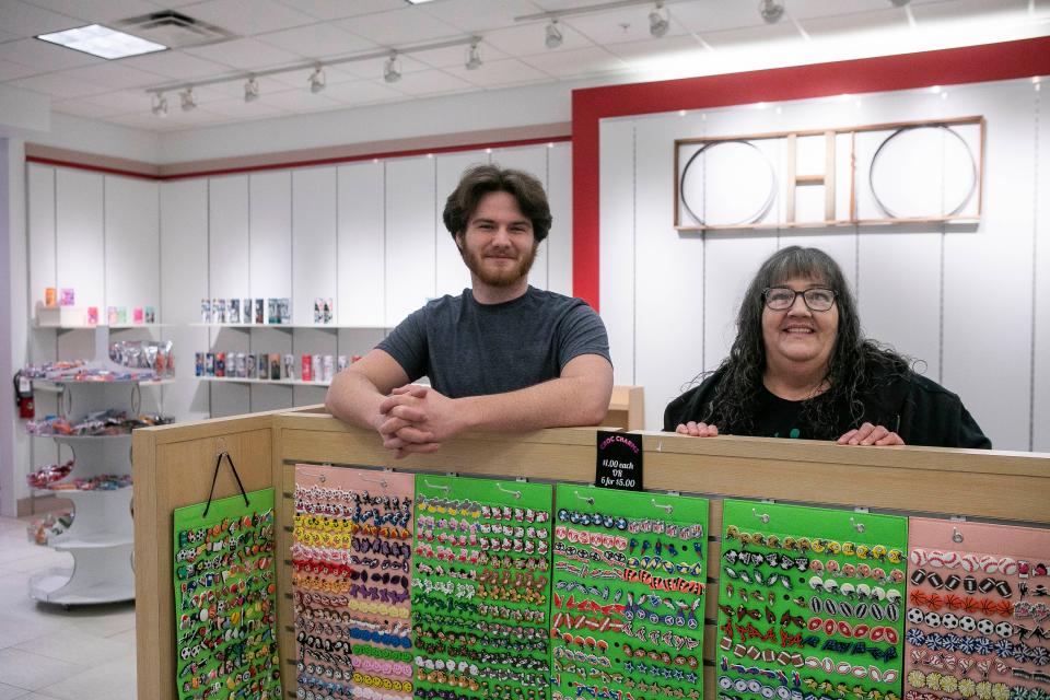 John Kirwan and his grandmother, Kathy Hammond, owners of Hometown Kreations, stand inside of their new store space inside of the River Valley Mall on January 24, 2024, in Lancaster, Ohio.
