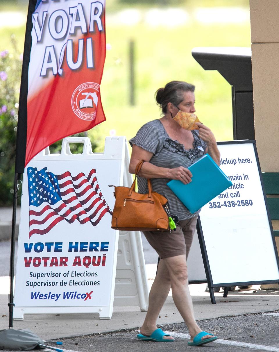 A voter made her way out of the Freedom Library in 2018 while taking part in early voting.
