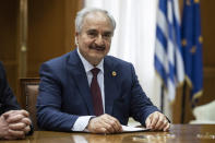 Libyan Gen. Khalifa Hifter looks on during his meeting with Greek Prime Minister Kyriakos Mitsotakis, in Athens, Friday, Jan. 17, 2020. The commander of anti-government forces in war-torn Libya has begun meetings in Athens in a bid to counter Turkey's support for his opponents. (AP Photo/Petros Giannakouris)