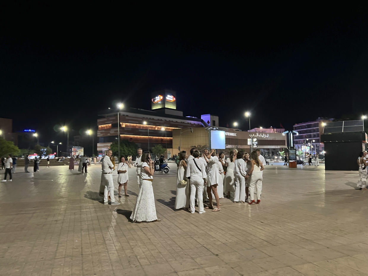 Tourists stand outside a hotel after an earthquake in Marrakech, Morocco, Friday, Sept. 8, 2023. A rare, powerful earthquake struck Morocco late Friday night, killing hundreds of people and damaging buildings from villages in the Atlas Mountains to the historic city of Marrakech. (AP Photo)