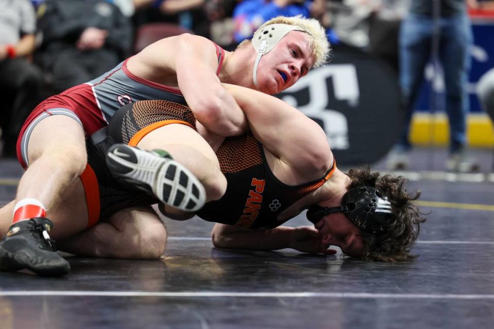 State College’s Pierson Manville controls Central York’s Elias Long in the 145-pound PIAA Class 3A semifinal match on Friday, March 8, 2024 at the Giant Center in Hershey.
