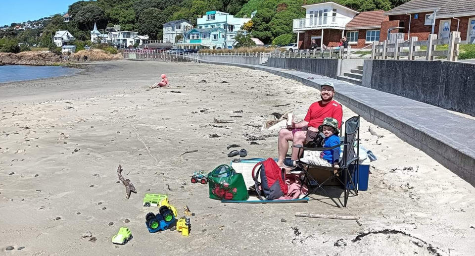 Steven Buck and his son William celebrating the boy's birthday on the beach.