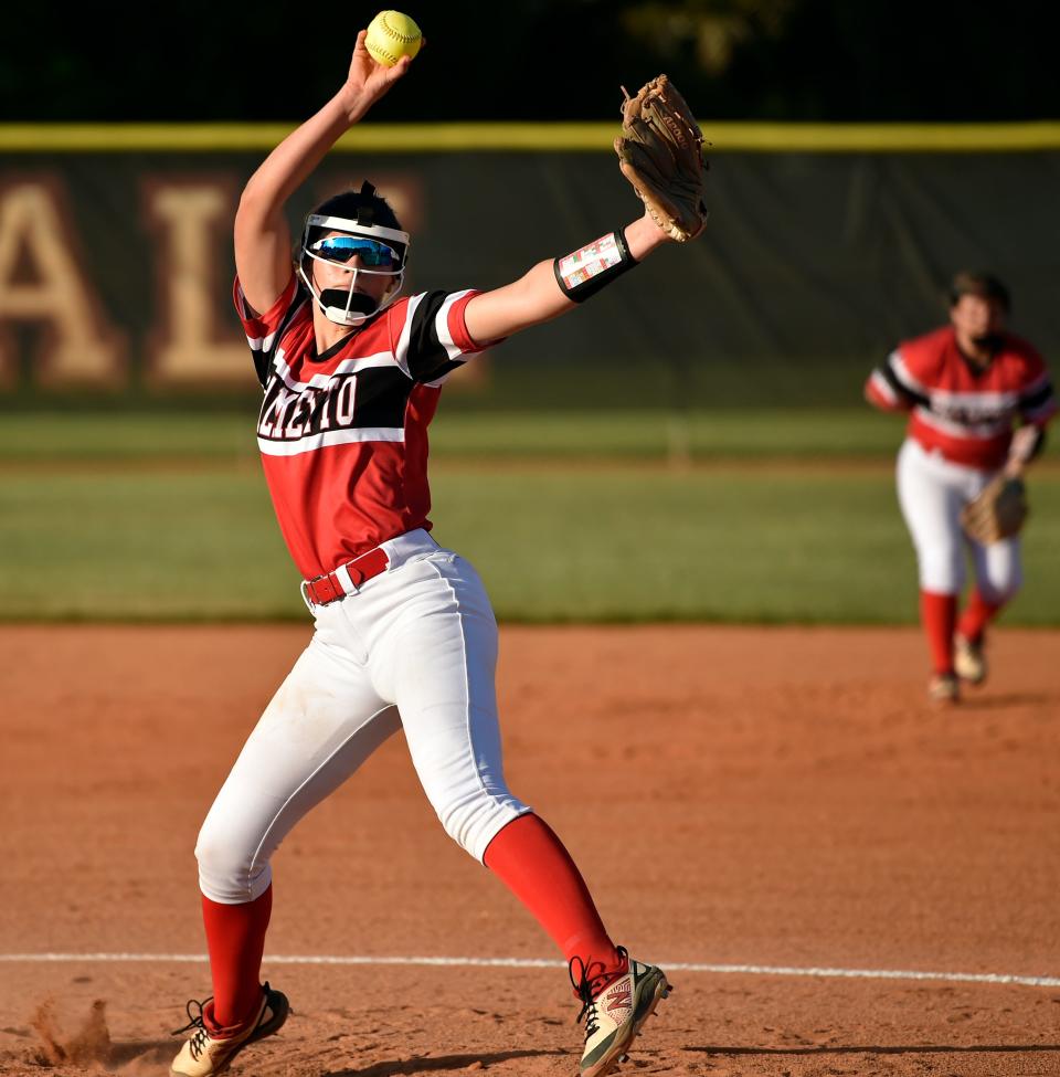 Palmetto High's Makenna Lee makes a pitch against Braden River High Wednesday night at the Pirates' softball field in Manatee County.