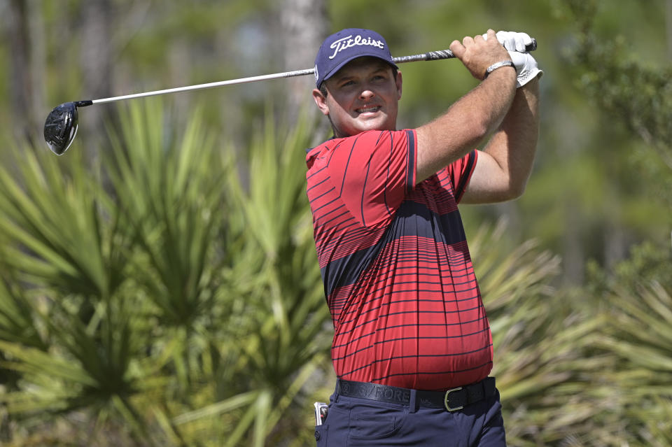 Patrick Reed watches his tee shot on the second hole during the third round of the Workday Championship golf tournament, Feb. 27, 2021, in Bradenton, Fla. (AP Photo/Phelan M. Ebenhack)