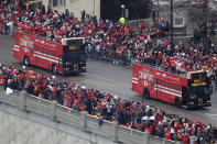 Busses carrying members of the Kansas City Chiefs travel in a parade through downtown Kansas City, Mo., Wednesday, Feb. 5, 2020, to celebrate the Chiefs victory in the NFL's Super Bowl 54. (AP Photo/Charlie Riedel)