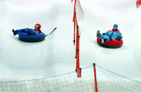 Visitors enjoy snow rides in the new Snow City at Al Othaim Mall in Riyadh, Saudi Arabia July 26, 2016. Picture taken July 26, 2016. REUTERS/Faisal Al Nasser