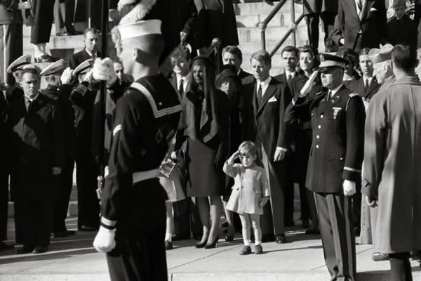 John F. Kennedy Jr. salutes as the casket of his father, the late President John F. Kennedy, is carried from St. Matthew's Cathedral in Washington. It was his third birthday. File Photo by Stan Stearns/UPI