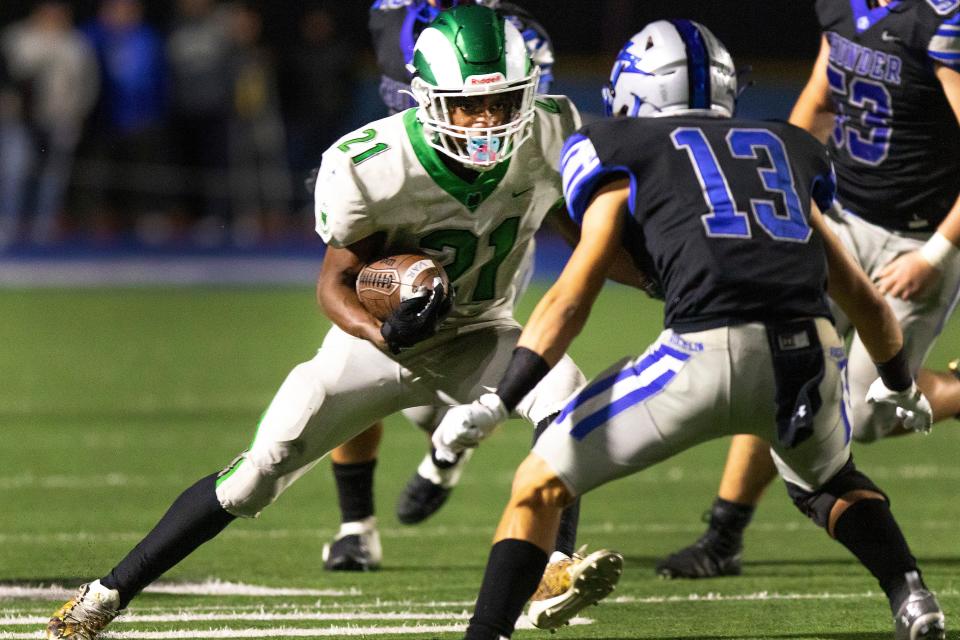 St. Mary's Asante Carter (21) stares down Thunders Austin Adams (13) and gets by him for a big gain during a game Nov. 19 at Rocklin Stadium.