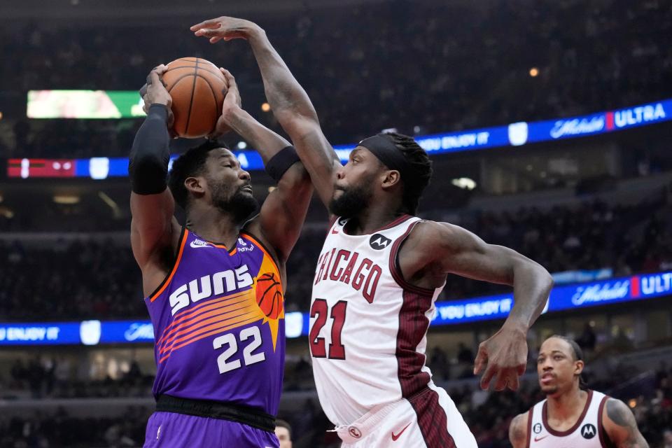 Phoenix Suns' Deandre Ayton (22) looks for a shot as Chicago Bulls' Patrick Beverley defends during the first half of an NBA basketball game on March 3, 2023, in Chicago.