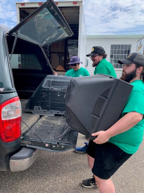 Dakota Weiffembach, an employee with St. Joseph-based Green Earth Electronics Recycling, managed on his own to move a 200-pound television during last week’s household hazardous waste and electronics recycling event in Centreville.
