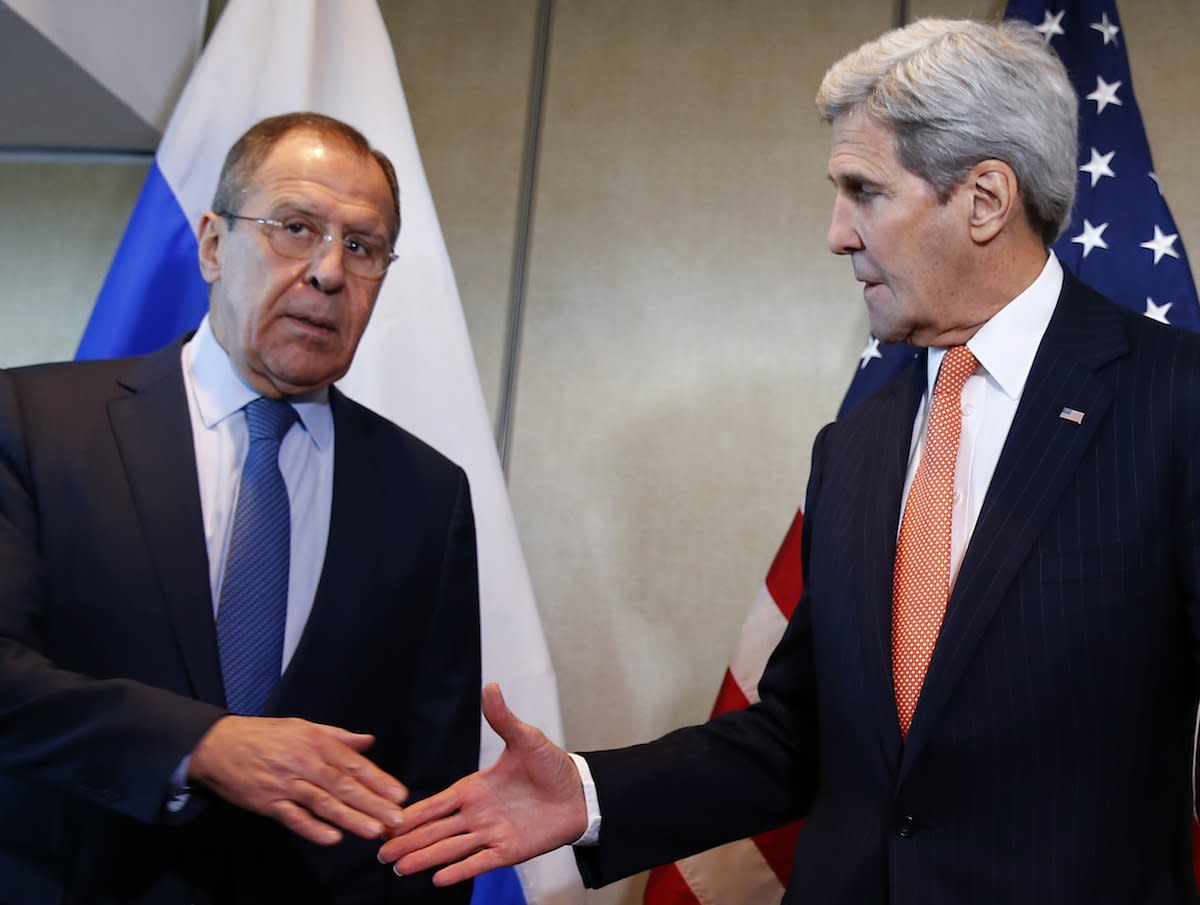 U.S. Foreign Secretary John Kerry and Russian Foreign Minister Sergei Lavrov (L) go for a handshake before their bilateral talks in Munich, Germany, February 11, 2016, ahead of the International Syria Support Group (ISSG) meeting.