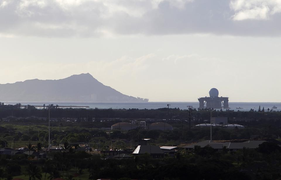 The U.S. Navy Sea-based X-Band radar leaves Pearl Harbor as two hurricanes approach the Hawaiian islands, in Honolulu, Hawaii, August 6, 2014. Hurricane Iselle barrelled west across the Pacific Ocean towards the Hawaiian Islands on Wednesday, where officials warned residents and tourists of possible flooding and mudslides and ordered schools closed. Tracking about two days behind Iselle was hurricane Julio, which was upgraded from a tropical storm on Wednesday and could also bring heavy surf and high winds. REUTERS/Hugh Gentry (UNITED STATES - Tags: ENVIRONMENT MARITIME MILITARY)