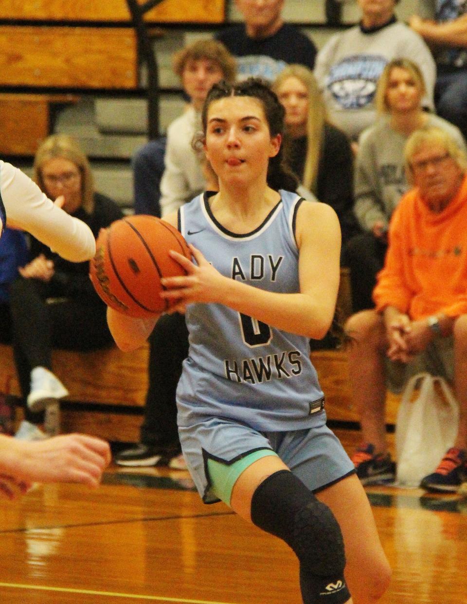 Chloe Sisco looks to pass the ball on a break opportunity for Prairie Central in its regional final game with Peotone Friday, Feb. 17.