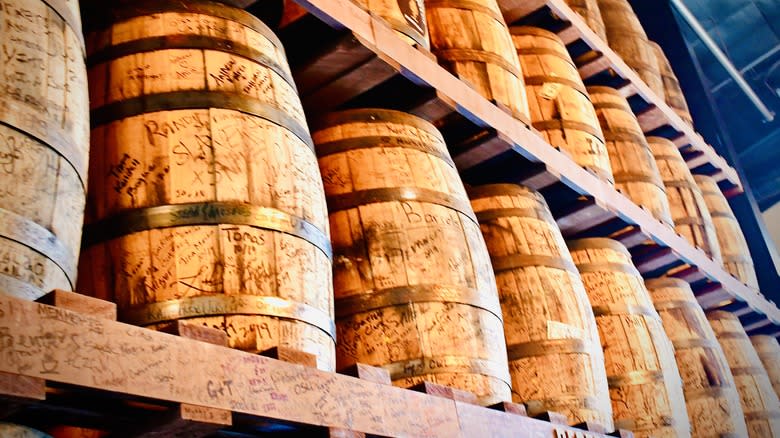 stacked rows of bourbon barrels