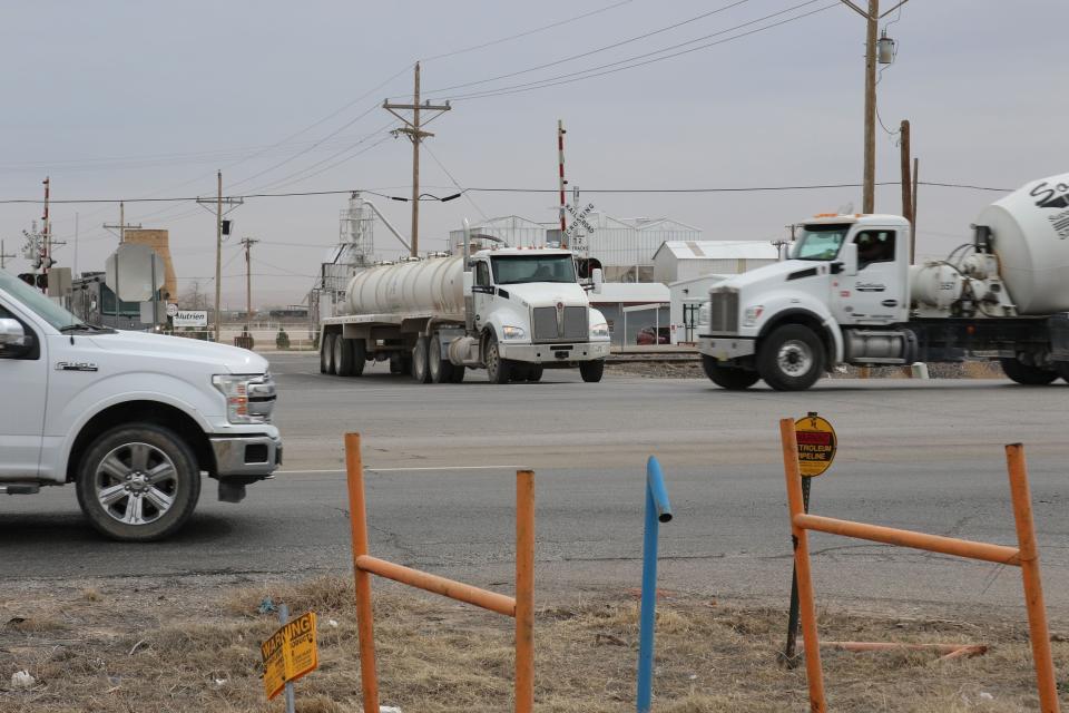 Semitrailers and a pickup truck attempt turns on Mill Road from U.S. 285 in Artesia on Feb. 27, 2024. State Rep. Jim Townsend (R-54) has petitioned the New Mexico Department of Transportation to place a traffic light at the intersection.