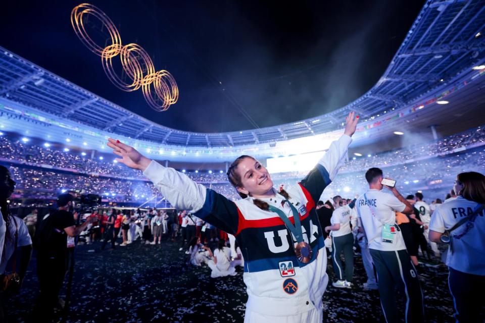 Team USA gold medalist wrestler Amit Elor celebrates in the pit at Stade de France during the closing ceremony