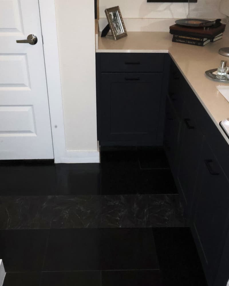 black marble bathroom floor after makeover