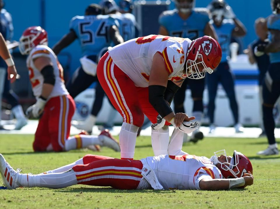 Patrick Mahomes lays on the field after a play against the Tennessee Titans.